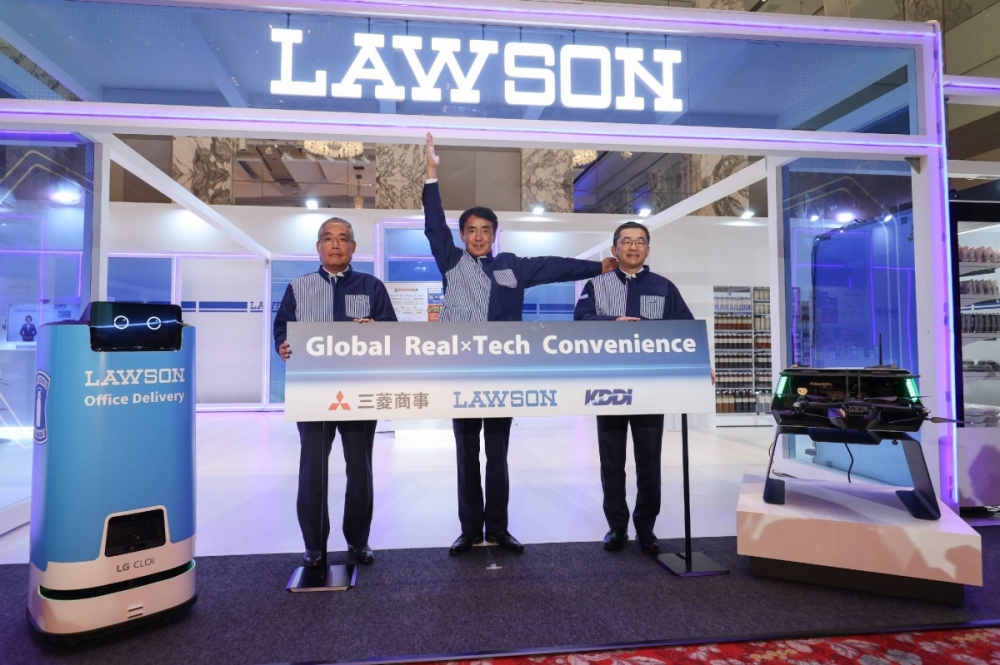 A group of men standing in front of a LAWSON sign